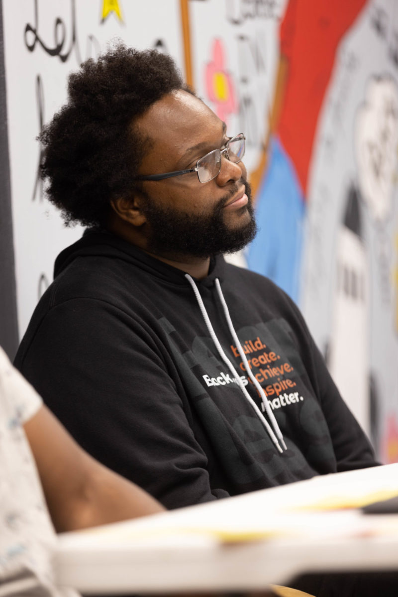 Tsonanda listening in black fearless sweatshirt